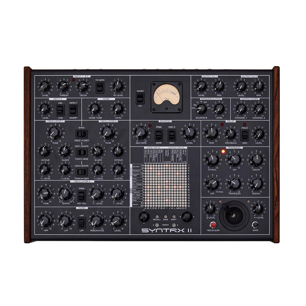 Top-down view of a black Erica Synths SYNTRX II synthesizer with multiple knobs, switches, a joystick, and a VU meter.