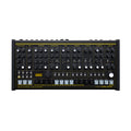 Black and yellow drum machine with many knobs, buttons, and pads labeled with various drum sound parameters.