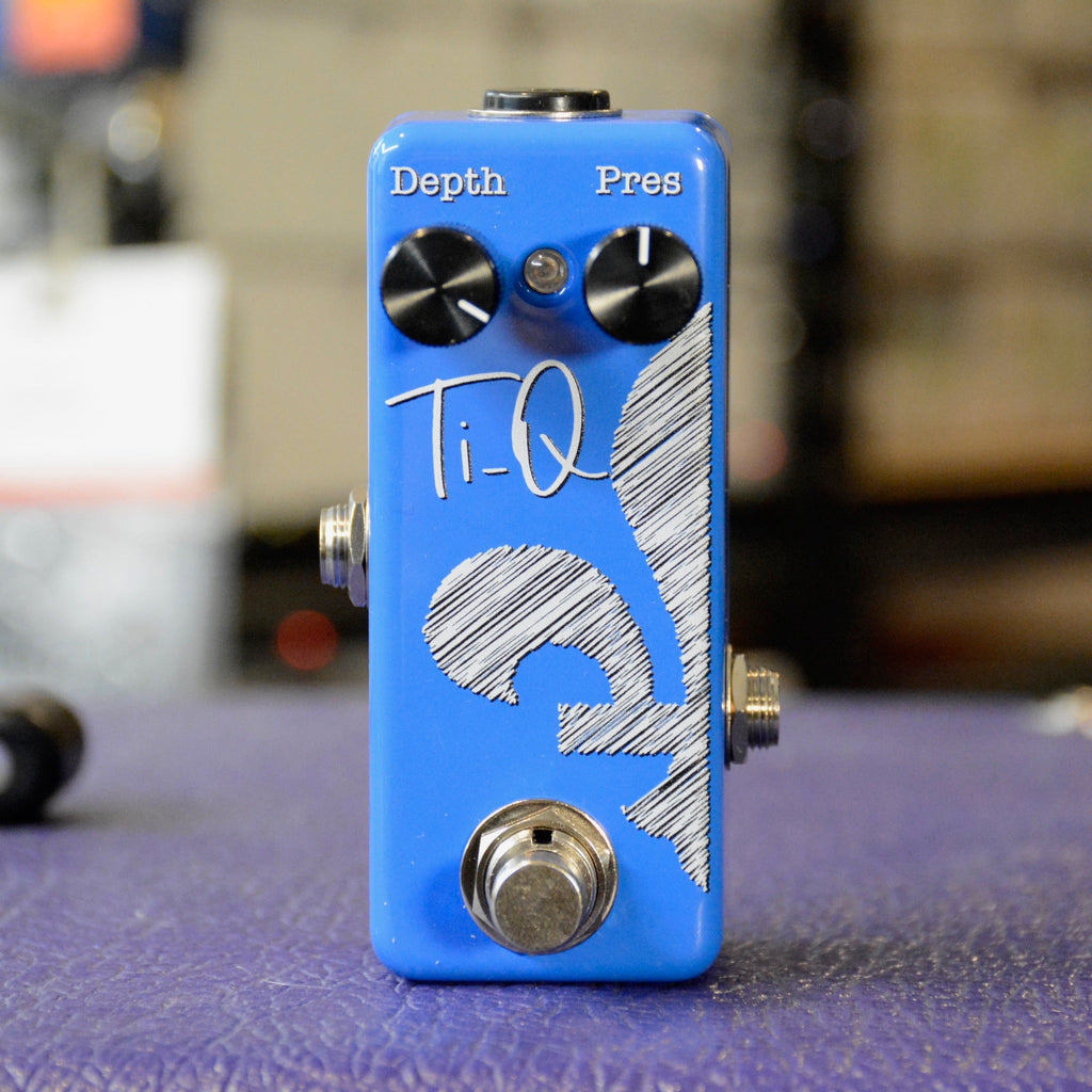 Blue Ti-Q guitar pedal with two black knobs labeled Depth and Pres and a metal footswitch.