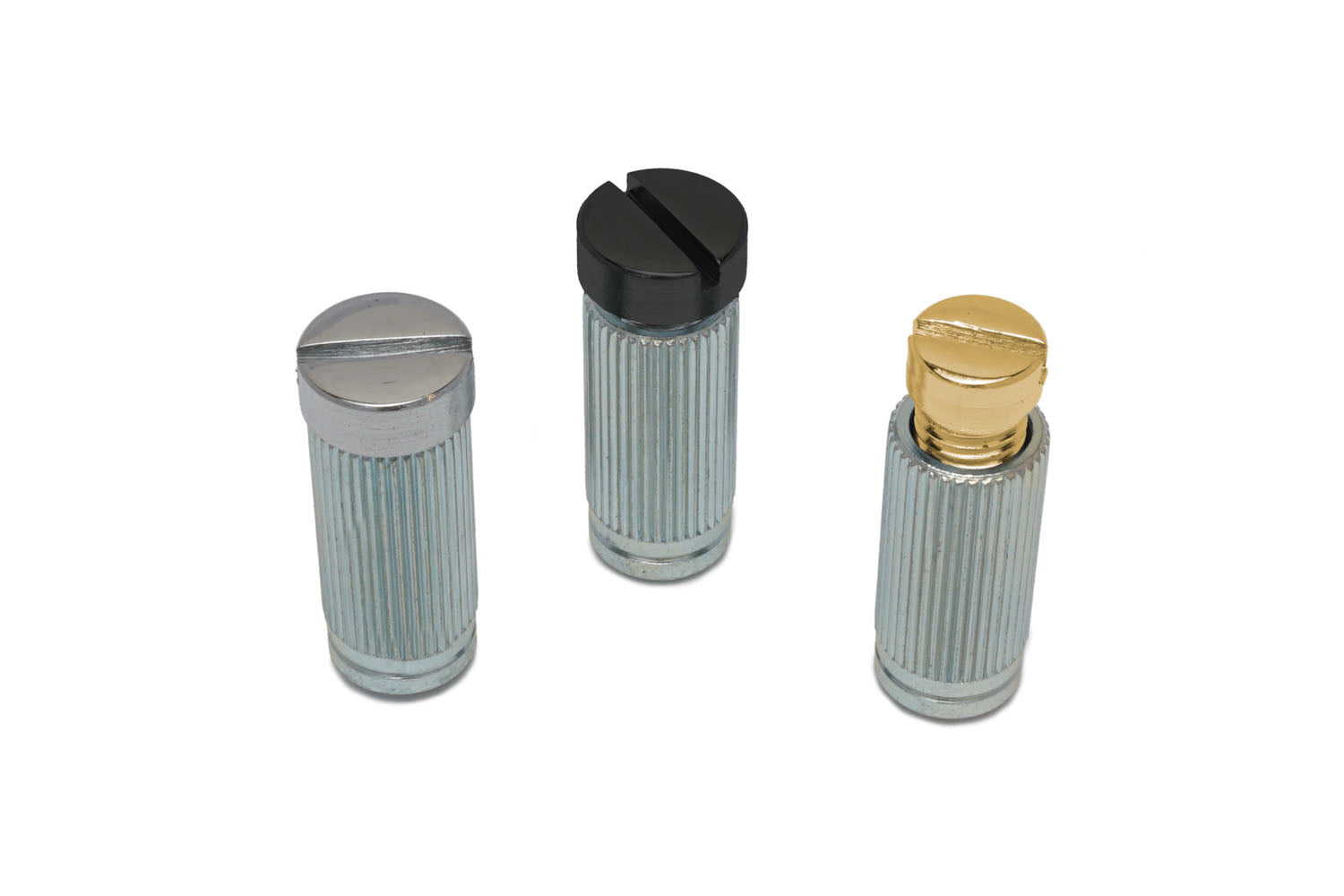 Three metal studs with ridged cylindrical bodies and slotted heads in silver, black, and gold colors on a white background.