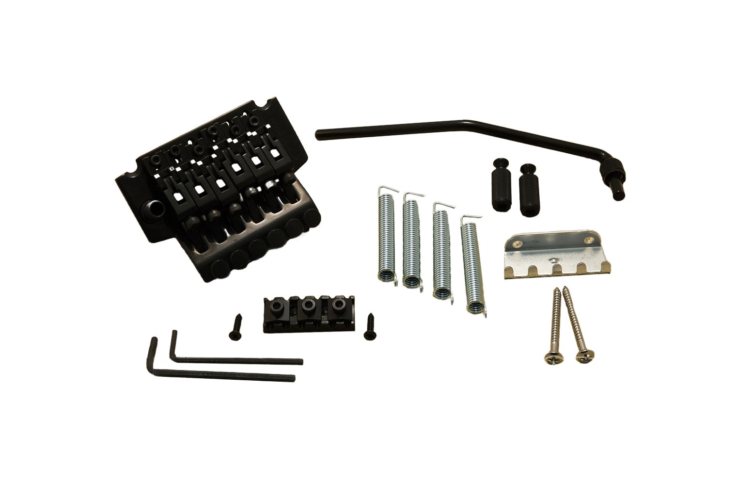 Black guitar tremolo bridge with springs, mounting screws, whammy bar, hex wrenches, and other hardware parts on white background.