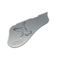 Silver metal guitar pickguard with an engraved eagle and the word GRETSCH.