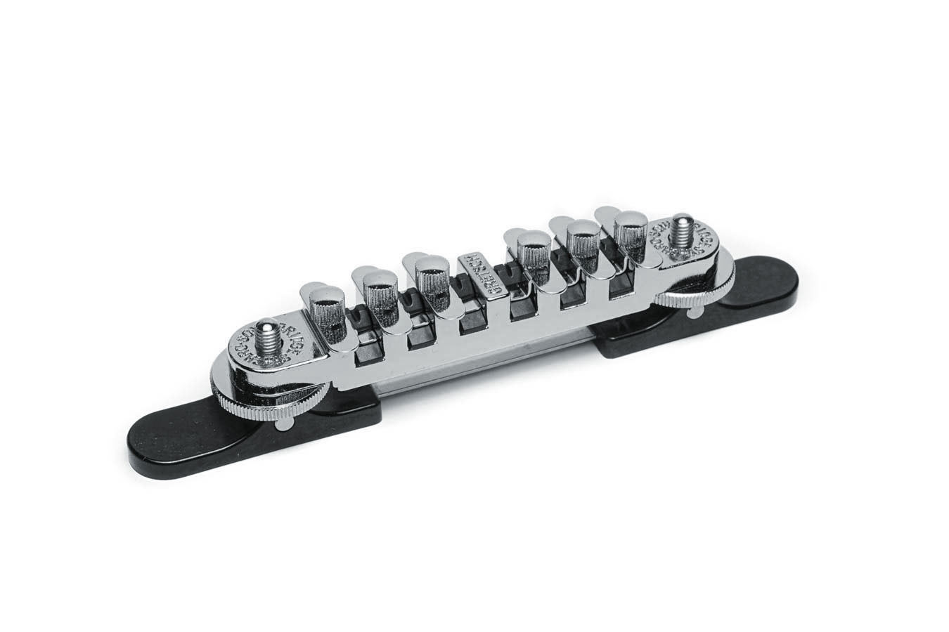 Chrome guitar bridge assembly with six adjustable saddles mounted on a black base plate.