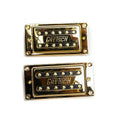 Two gold rectangular guitar pickups with black sections and GRETSCH logo on a white background.