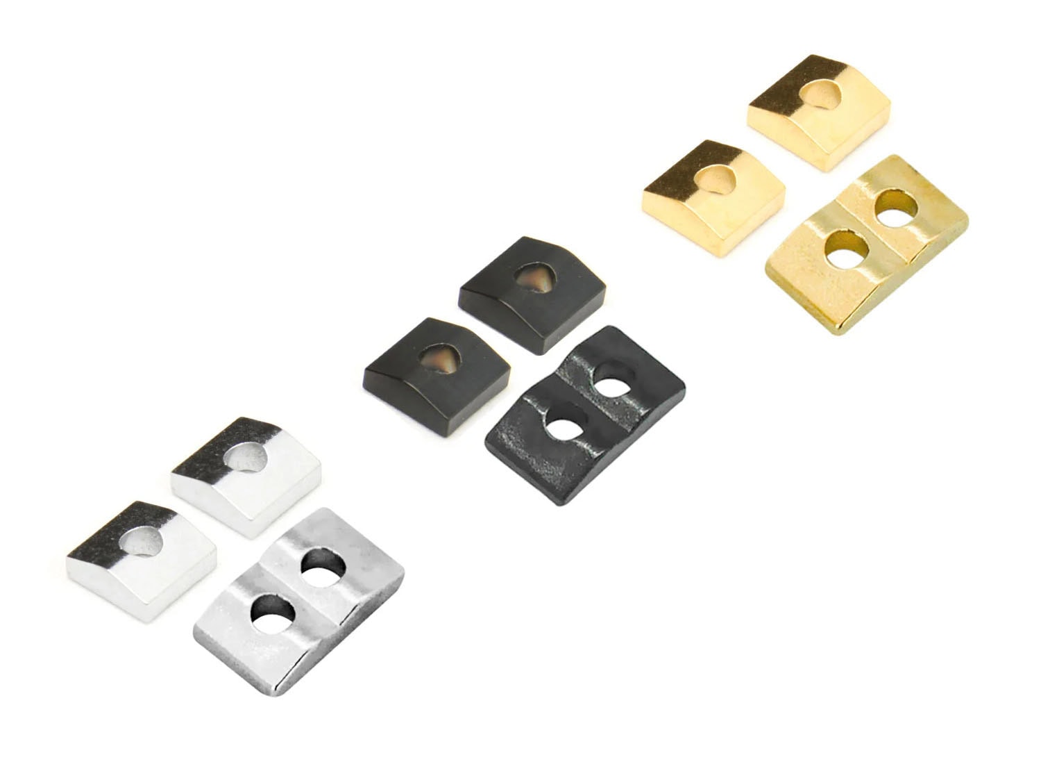Three sets of metal nut clamping blocks in silver, black, and gold colors arranged on white background.