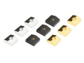 Nine small squared metal blocks in three different colors arranged in three rows on a white background.