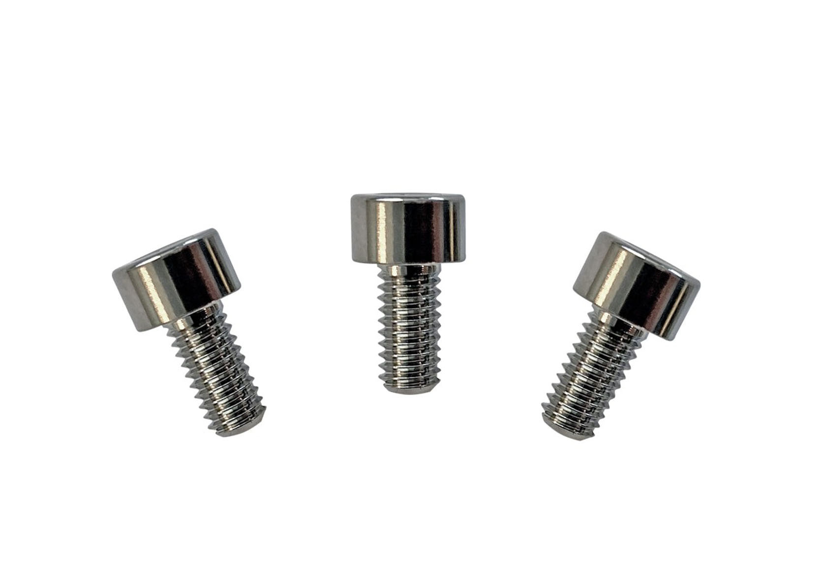Three silver metallic screws with cylindrical heads on a white background.