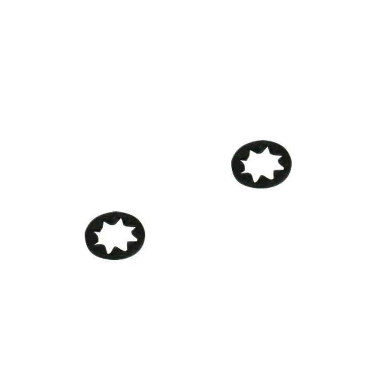 Two black star-shaped metal washers on a white background.
