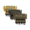 Three Floyd Rose Special tremolo bridge units in gold and two different silver tones.