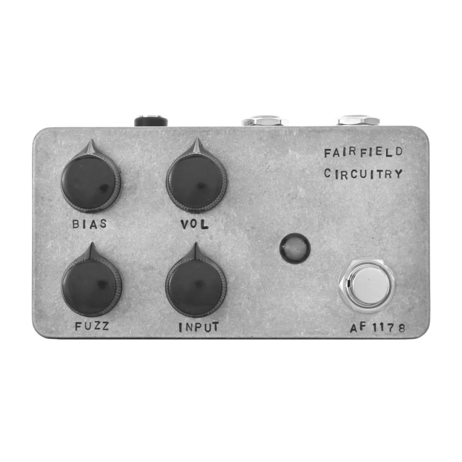 Gray metal guitar effects pedal with four black knobs, two jacks, a footswitch, and labeled controls.