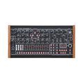 Front view of analog filterbank sequencer and synthesizer with knobs, sliders, buttons, ports, and wooden sides.