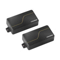 Two black rectangular guitar pickups with gold line design and FISHMAN branding.