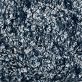 Close-up of a 4-ply grey pearloid pickguard blank material with a textured pattern.