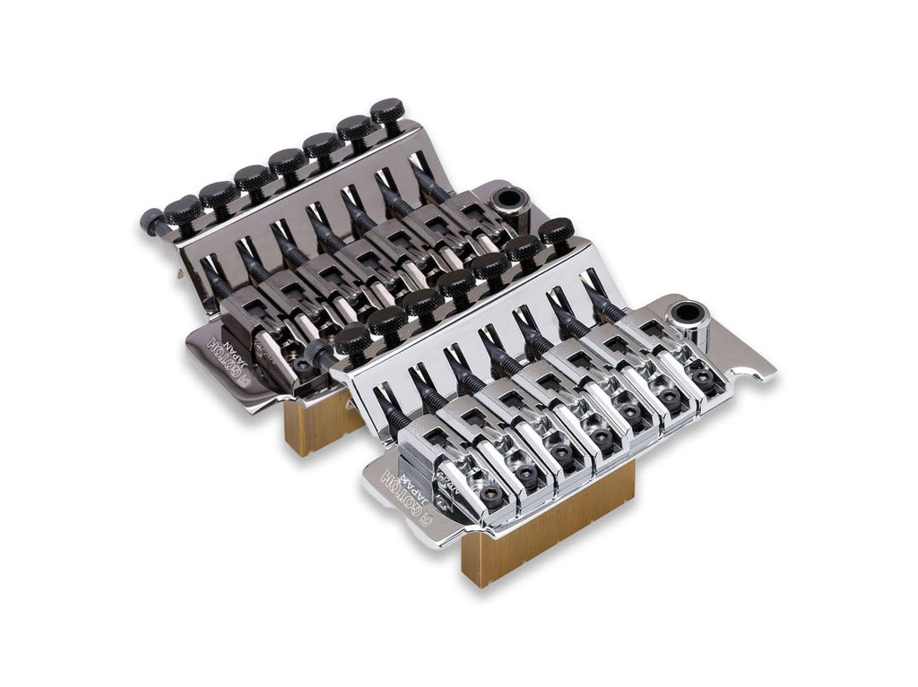 Two silver metal guitar bridges with black adjuster knobs on a white background.
