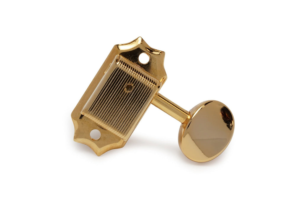 A single gold-colored vintage style guitar tuning peg machine head