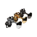 Three metal guitar tuning machine heads in silver, gold, and black colors on a white background.