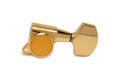 Single gold-colored guitar tuning machine head with large button and mounting hole.