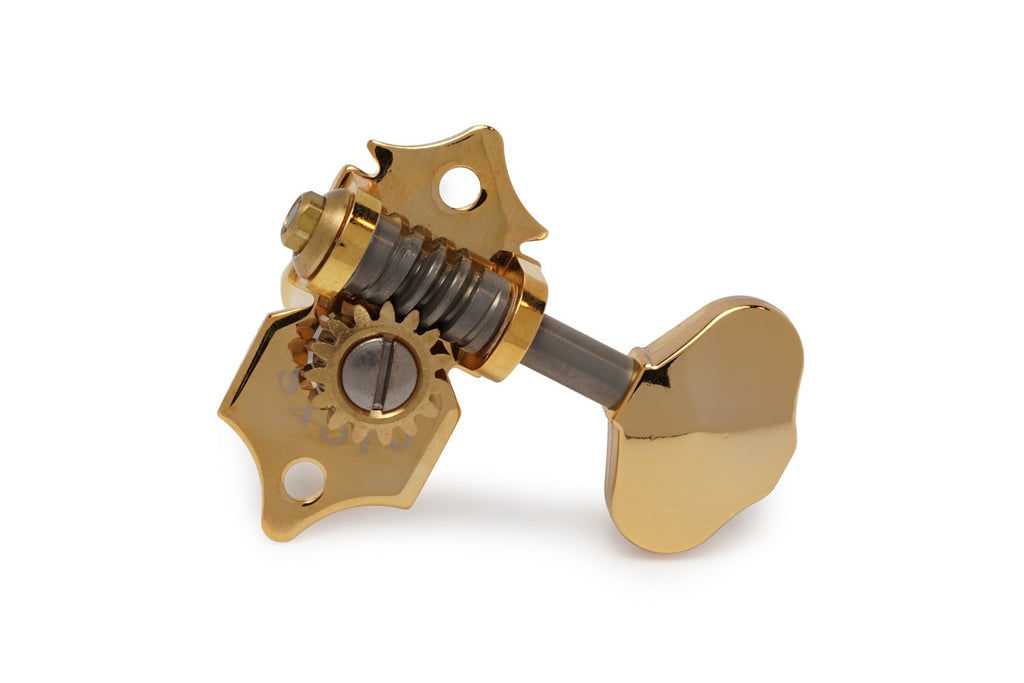 Single gold-colored guitar tuning machine head with worm gear and mounting holes on a white background.