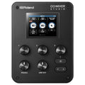 Top view of a black Roland Go:Mixer Studio audio mixer with display screen, rotary knobs, and buttons.