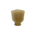 Cream-colored keystone-shaped button for tuning machine head.