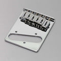 Chrome-finished guitar bridge plate with six adjustable saddles and three mounting holes on a gray background.
