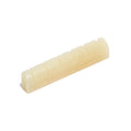 Off-white shaped and slotted guitar nut piece shown on white background.