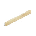 Off-white shaped guitar saddle part viewed at an angled perspective on a white background.