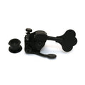 Black clover-shaped bass guitar tuner with adjustment knob and separate threaded nut.
