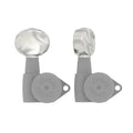 Two gray Hipshot branded guitar tuning machine heads with pearloid buttons shown from the side.