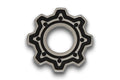 Silver metal gear-shaped washer with black detailing and central hole on a white background