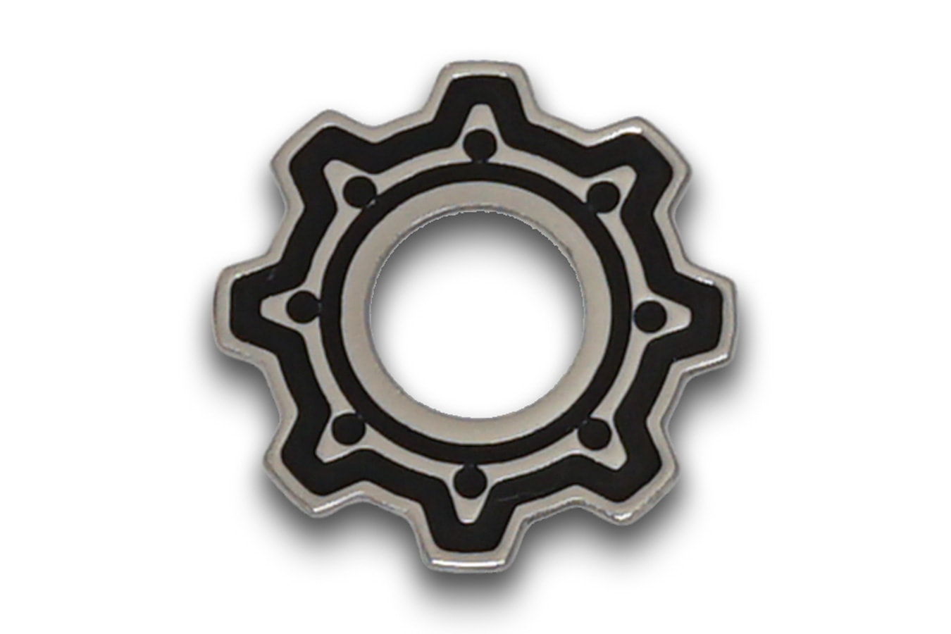 Silver metal gear-shaped washer with black detailing and central hole on a white background