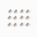 Twelve small silver metal set screws arranged in a defined pattern on a white surface.