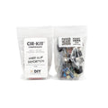 Two clear plastic bags containing electronic components and parts for a DIY circuit kit with labels describing contents