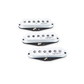 Three white single-coil guitar pickups with black bases and signatures on top, shown on a white background.