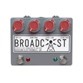 Gray audio effects pedal with four red rotary knobs, two footswitches, and white label saying BROADCAST by Hudson Electronics.