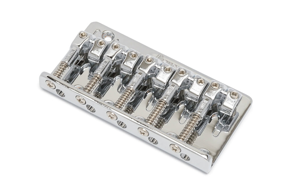 Chrome metal bridge part with five adjustable saddles for a stringed instrument.