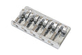 Chrome metal bridge part with five adjustable saddles for a stringed instrument.