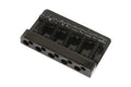 Black metal guitar or bass bridge with five string saddles and adjustment springs.