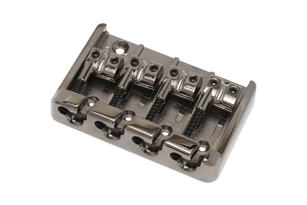 Metal guitar bridge with four string saddles and adjustment screws shown from an angled top view.