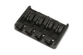 Black 4-string electric bass guitar bridge with four adjustable saddles shown on a white background.