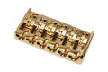 Gold-colored metal six-string guitar or bass bridge with fine-tuning adjustment screws