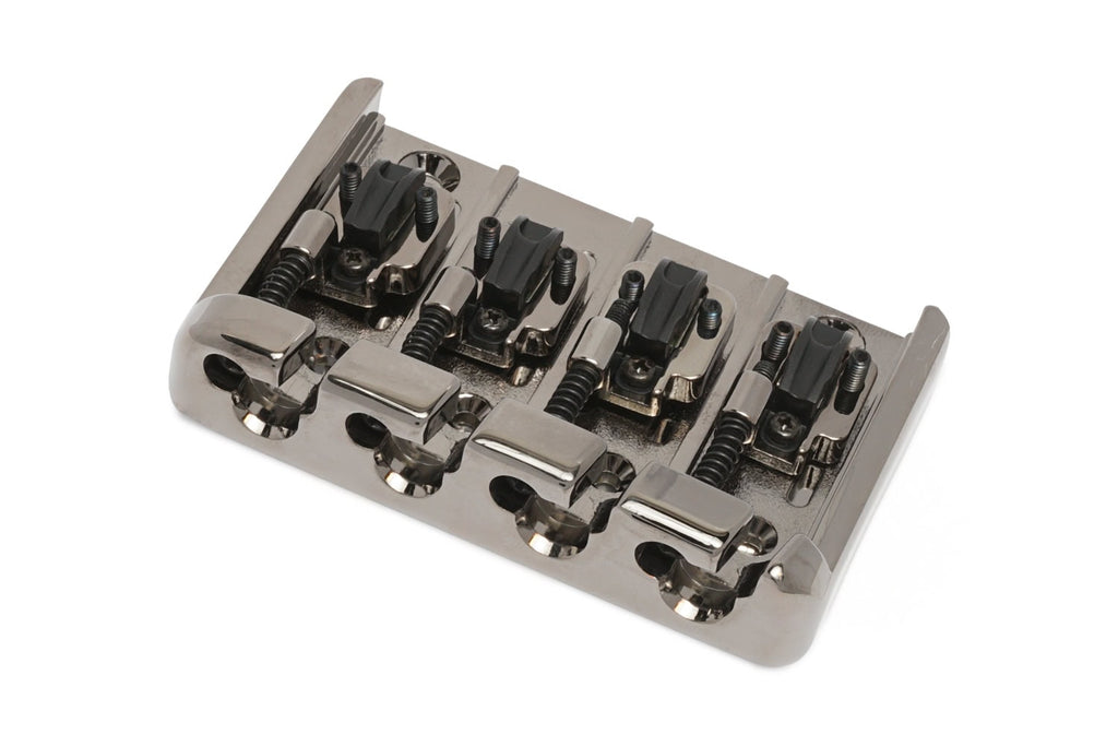 Metallic bridge component for string instrument with four adjustable saddles and black plastic parts.