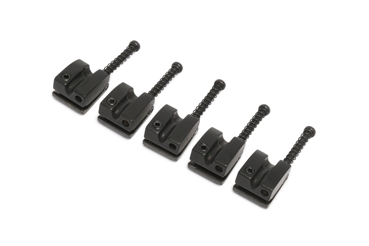 Five black metal saddles each with a screw and spring arranged in a row on white background.