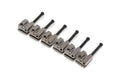 Six metallic gray bass saddles with black adjustment screws arranged in a row on a white background.