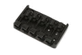 Black metal 5-string bass guitar bridge with individual string saddles and adjustment screws.