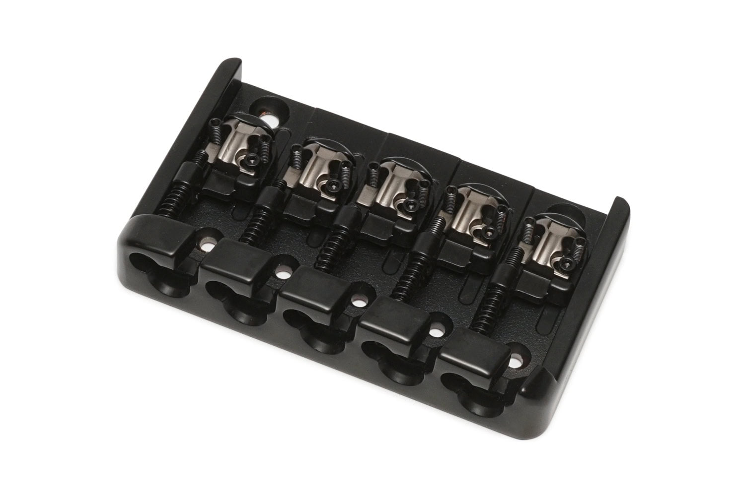 Black metal bridge for a five-string bass guitar with individual string saddles and adjustment screws.