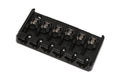 Black metal bass guitar bridge with six individual adjustable saddles and screws.