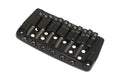 Black metal fixed guitar bridge with six saddle springs and screws on white background.