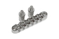 Chrome guitar bridge with six adjustable saddles and two mounting posts on a white background.
