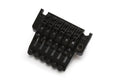 Black six-string guitar tremolo bridge part with fine tuning knobs on white background.